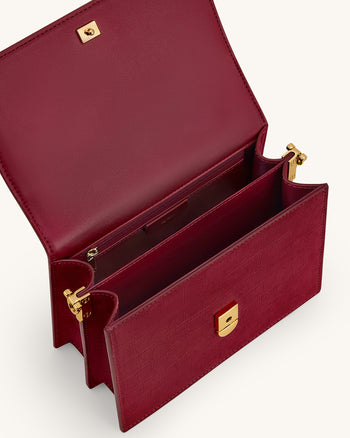Mini tracolla con patta in finto suede goffrato cocco - Borgogna