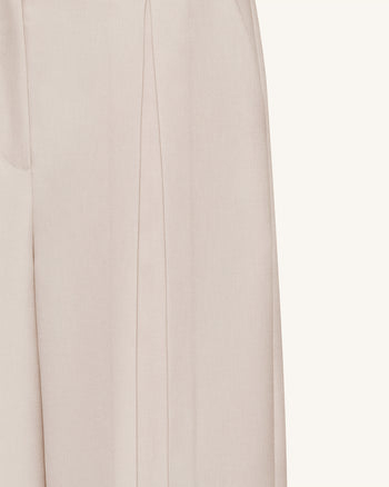Pantaloni a gamba larga plissettati - Beige