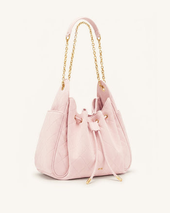 Rowan Sac seau matelassé à chaîne en faux suède - Rose