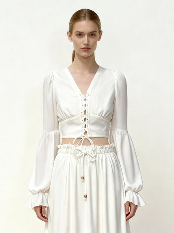 Blusa crop in chiffon con maniche a lanterna e nodo frontale - Bianco