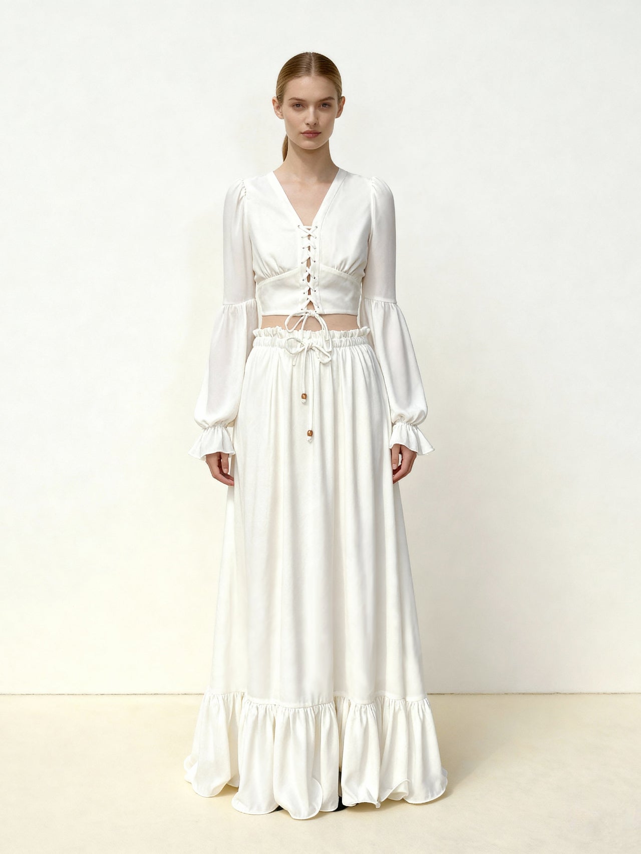 Blusa crop in chiffon con maniche a lanterna e nodo frontale - Bianco