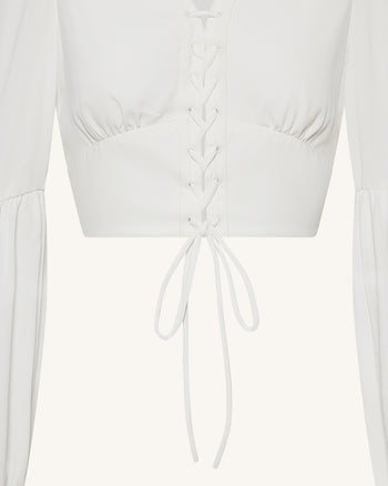 Blusa crop in chiffon con maniche a lanterna e nodo frontale - Bianco